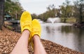 Woman legs in wearing sneakers yellow