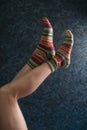 Woman legs in wool knitted socks