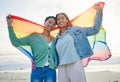 Woman, lesbian couple and pride flag on beach together in happiness for LGBTQ community or rights. Portrait of proud and Royalty Free Stock Photo