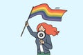 Woman with LGBTQ flag shout in megaphone