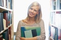 Woman, library and book, portrait with story for education and knowledge with smile on campus. Student, bookstore and Royalty Free Stock Photo