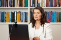 Woman library computer headset webcam Royalty Free Stock Photo