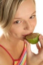 Woman licking lime