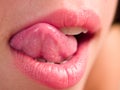 Woman licking lips 
