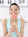 Woman licking sweet sugar candy Royalty Free Stock Photo