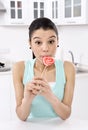 Woman licking sweet sugar candy