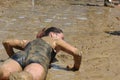 A woman lie down in the mud Royalty Free Stock Photo