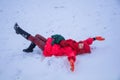 Woman lie down in snowfield