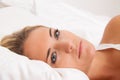 Woman lies awake in bed. Sleepless and thoughtful. Royalty Free Stock Photo