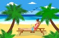 A woman lies on a sun lounger on a sandy beach near the ocean, drinks a cocktail and relaxes. Vacation at sea concept. Royalty Free Stock Photo