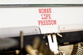 Woman life freedom symbol. Concept words Woman Life Freedom typed on an old retro typewriter on a beautiful white paper background Royalty Free Stock Photo