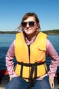 Woman in life jacket on boat