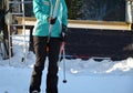 Woman on the lift learns to convulsively hold a yellow tubular handle topped with a plastic plate on which she sits. winter sports