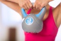 Woman lifting kettlebell Royalty Free Stock Photo