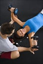 Woman lifting weights Royalty Free Stock Photo