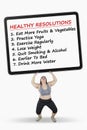 Woman lifts board with healthy resolutions