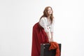 Woman lifts a heavy suitcase