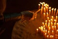 Woman lighting candles in a church Royalty Free Stock Photo