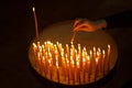 Woman lighting candles in a church