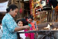 Woman Lighting Lamp