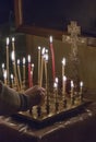 Woman lighting prayer candle Royalty Free Stock Photo