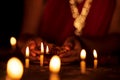 Woman Lighting Up Candles on Diwali