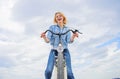 Woman likes to ride bike. Girl enjoy short cycle tour with stop offs along way and travel. Girl holds handlebar of bike