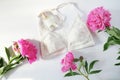 Woman lingerie with accessories and flowers collage on white, flat lay, top view. Royalty Free Stock Photo