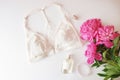 Woman lingerie with accessories and flowers collage on white, flat lay, top view. Royalty Free Stock Photo