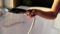 A woman in lingerie fills the tub with water for a relaxing bubble bath. The concept of body care, hygiene and