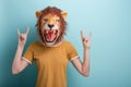 Woman in lion mask with hands in rock sign, isolated