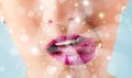 Woman lips blowing abstract white lights - close up Royalty Free Stock Photo