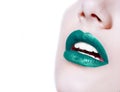 Woman lips with glossy green lipstick