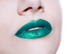 Woman lips with glossy green lipstick