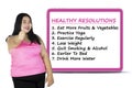 Woman with a list of healthy resolutions