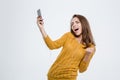 Woman listening music in headphones and dancing Royalty Free Stock Photo