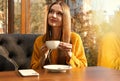 Woman listening to audiobook at table Royalty Free Stock Photo