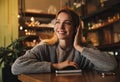 Woman listening to audiobook at table Royalty Free Stock Photo