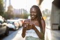 Woman listening to music with earphones in the city Royalty Free Stock Photo