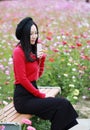 Young woman sit and listening to music with headphones