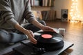 Woman listening to music, relaxing, enjoying life at home. Turntable playing vinyl LP record. Royalty Free Stock Photo