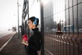 Woman listening to music while working out and jogging outdoor Royalty Free Stock Photo