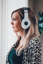 Woman listning with wireless headphones Royalty Free Stock Photo