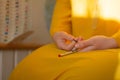 Woman, lit hand, counts Malas, strands of gemstones beads