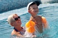 Woman and little boy bathes in pool Royalty Free Stock Photo