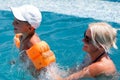 Woman and little boy bathes in pool Royalty Free Stock Photo