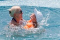 Woman and little boy bathes in pool Royalty Free Stock Photo