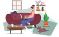 Woman with a little cat on the sofa and dog. Work From Home with a laptop