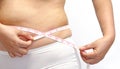 Woman with little fat measuring her stomach Royalty Free Stock Photo