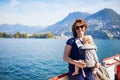 Woman with little girl enjoying scenic view Lugano from the lake Royalty Free Stock Photo